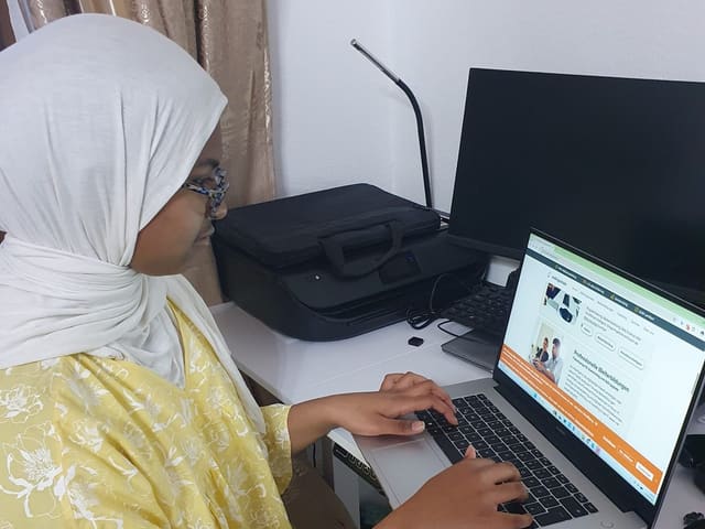 A Codinzy student working on a laptop
